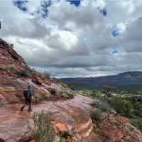 Hiking across exposed slickrock, smooth sandstone common on Sedona’s trails