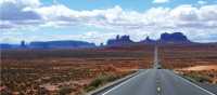 A long open road through Monument Valley | Jake Hutchins